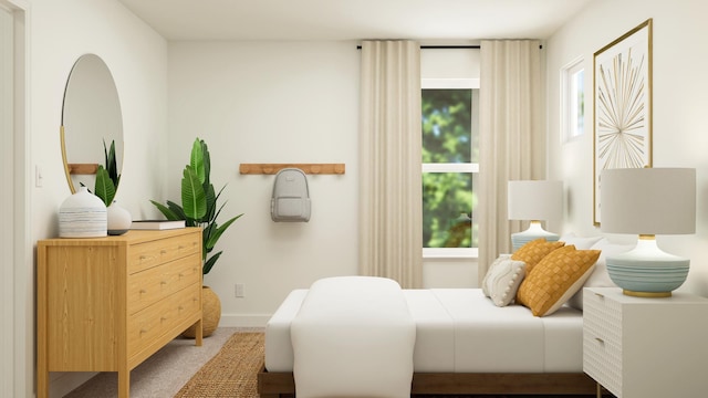 bedroom with carpet floors and baseboards
