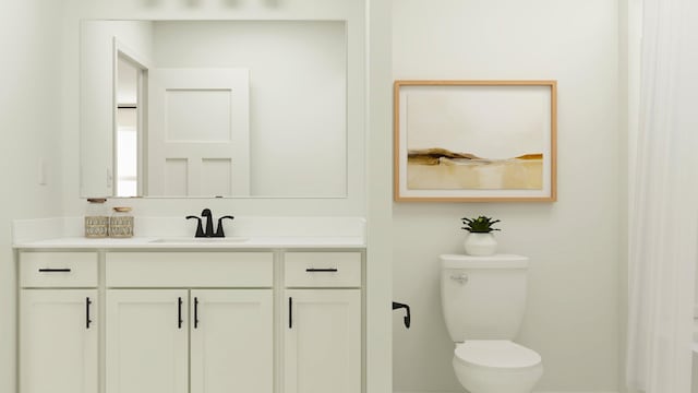 bathroom featuring vanity and toilet