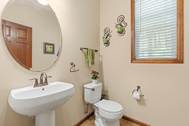 12800 Garrett Ct, Apple Valley, MN 55124 - half bath with baseboards, toilet, and a sink