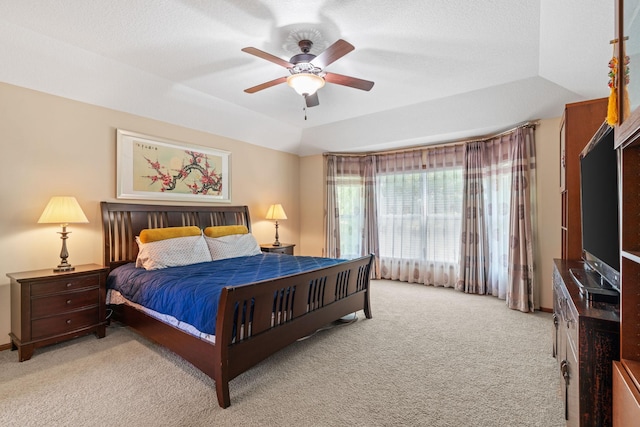 12800 Garrett Ct, Apple Valley, MN 55124 - bedroom featuring light carpet, a tray ceiling, and a ceiling fan