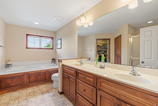 12800 Garrett Ct, Apple Valley, MN 55124 - bathroom featuring a shower stall, double vanity, a bath, toilet, and a spacious closet