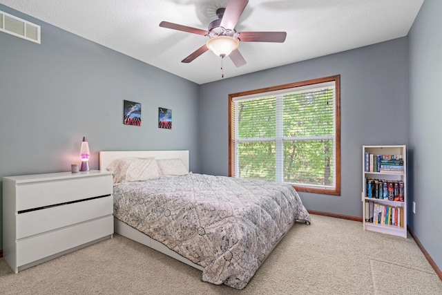 12800 Garrett Ct, Apple Valley, MN 55124 - carpeted bedroom with baseboards and a ceiling fan