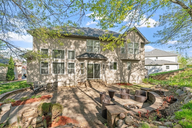 12800 Garrett Ct, Apple Valley, MN 55124 - rear view of property featuring a patio, an outdoor fire pit, and entry steps