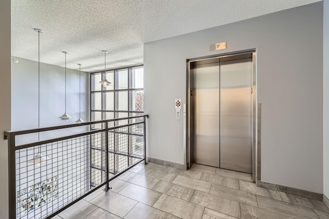 820 Emerald St Unit 402, Saint Paul, MN 55114 - corridor with elevator, a wall of windows, a textured ceiling, and baseboards