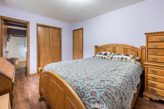 bedroom featuring a closet, dark wood-type flooring, and baseboards
