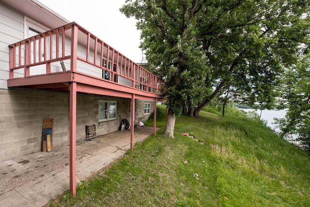 view of yard featuring a patio and a deck