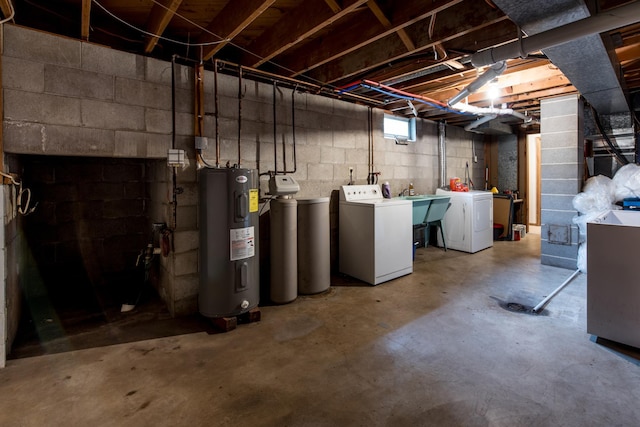 basement with independent washer and dryer, water heater, and a sink