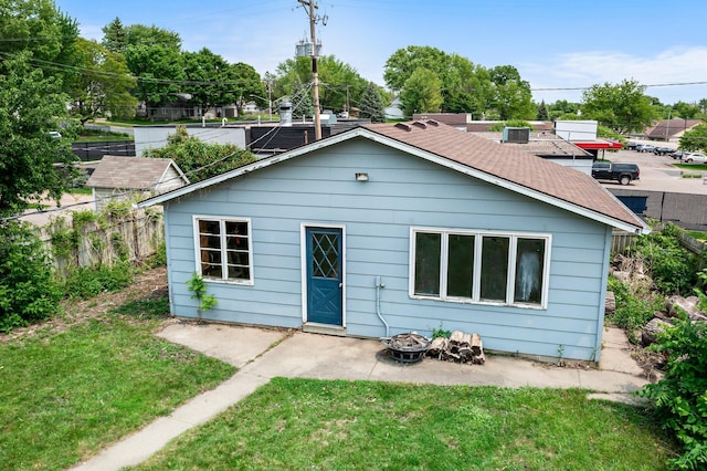 517 Olive St S, Waconia, MN 55387 - rear view of property featuring a patio area, a fire pit, and roof with shingles