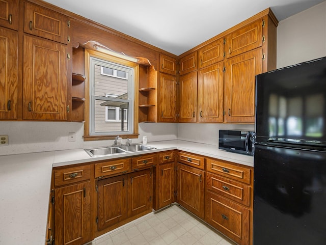 517 Olive St S, Waconia, MN 55387 - kitchen with black appliances, open shelves, light countertops, and brown cabinets