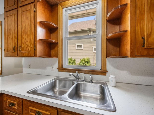 517 Olive St S, Waconia, MN 55387 - kitchen featuring open shelves, light countertops, and brown cabinetry