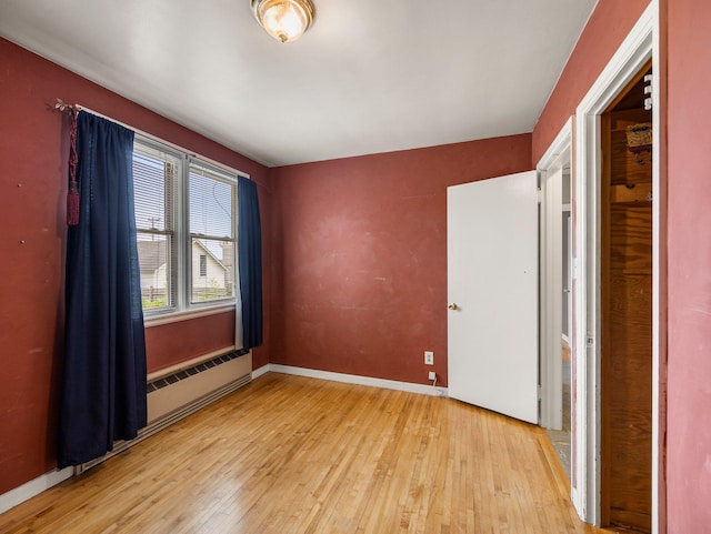 517 Olive St S, Waconia, MN 55387 - unfurnished bedroom featuring light wood-type flooring and baseboards
