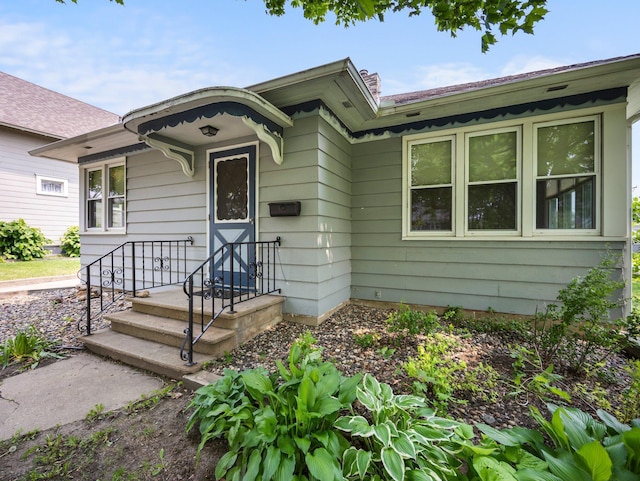 517 Olive St S, Waconia, MN 55387 - property entrance featuring a chimney