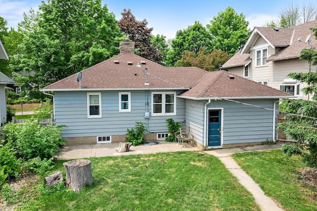 517 Olive St S, Waconia, MN 55387 - rear view of property with a patio, a chimney, and roof with shingles
