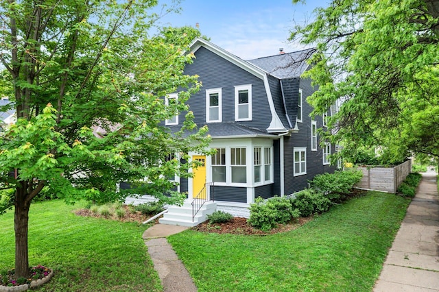 3100 29th Ave S, Minneapolis, MN 55406 - dutch colonial featuring a shingled roof, a gambrel roof, a front yard, and entry steps
