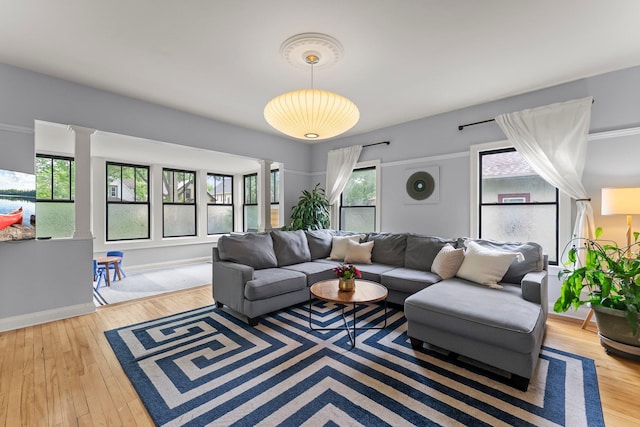 3100 29th Ave S, Minneapolis, MN 55406 - living room with hardwood / wood-style flooring, baseboards, and decorative columns