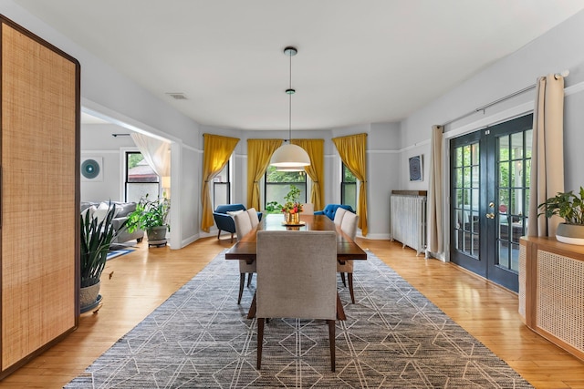 3100 29th Ave S, Minneapolis, MN 55406 - dining space with wood finished floors, french doors, and baseboards