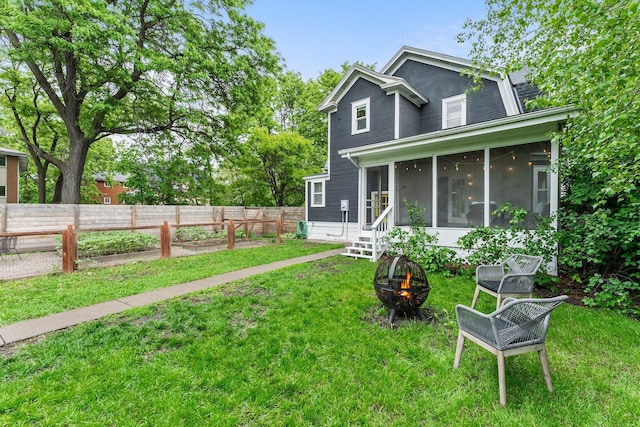 3100 29th Ave S, Minneapolis, MN 55406 - view of yard with an outdoor fire pit and a sunroom