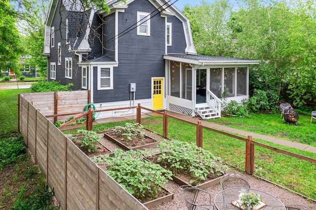 3100 29th Ave S, Minneapolis, MN 55406 - back of house with a sunroom and a garden