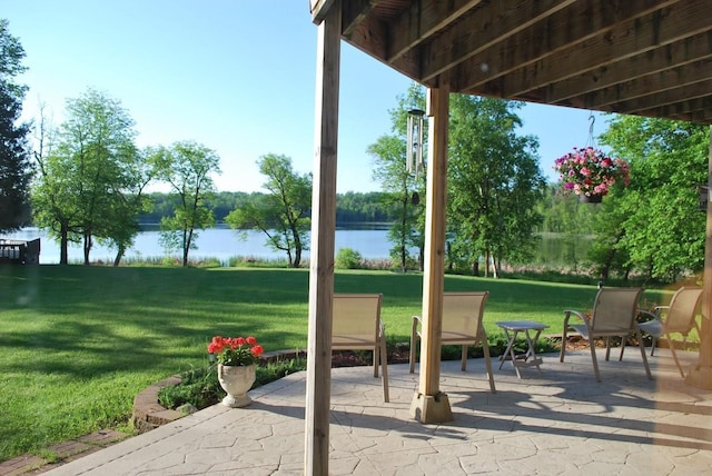 499 Tamarack Ct NE, Tenstrike, MN 56683 - view of patio / terrace with a water view