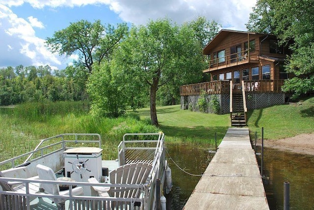 499 Tamarack Ct NE, Tenstrike, MN 56683 - dock area featuring a yard and a wooden deck