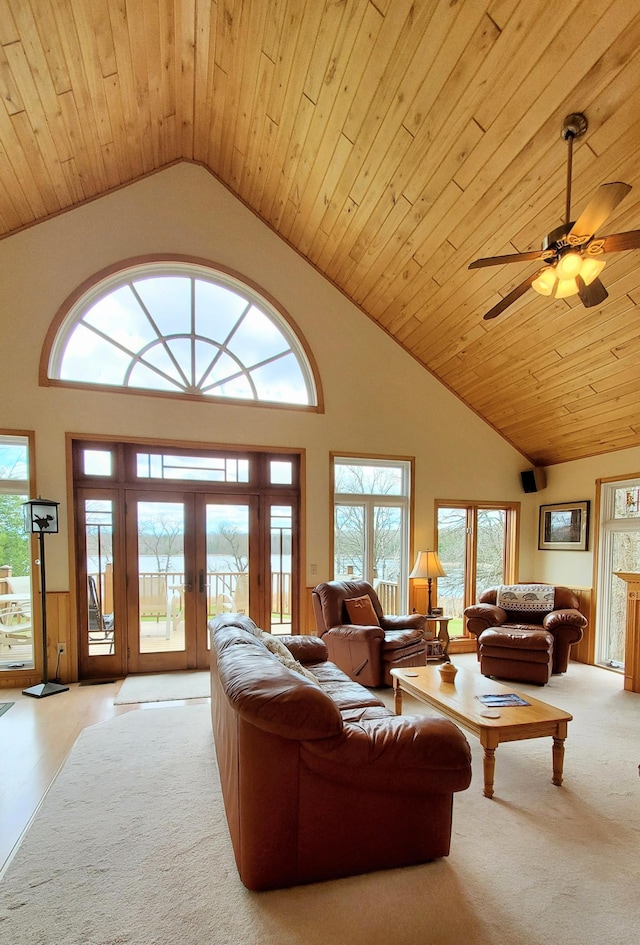 499 Tamarack Ct NE, Tenstrike, MN 56683 - living room with light colored carpet, wooden ceiling, french doors, and a ceiling fan