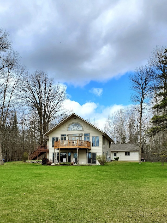 499 Tamarack Ct NE, Tenstrike, MN 56683 - rear view of property with a wooden deck, a yard, and stairway