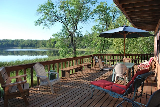 499 Tamarack Ct NE, Tenstrike, MN 56683 - wooden terrace with a wooded view and a water view