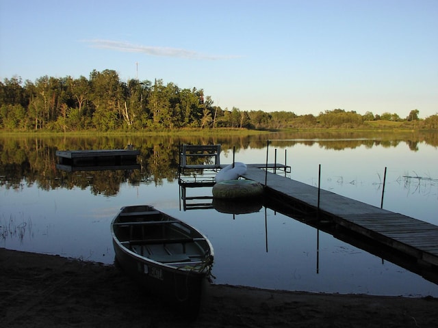 499 Tamarack Ct NE, Tenstrike, MN 56683 - dock area with a water view and a forest view