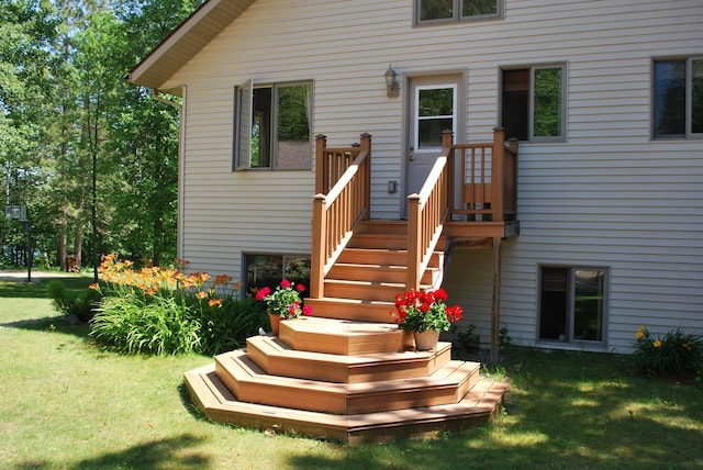 499 Tamarack Ct NE, Tenstrike, MN 56683 - back of house featuring a yard