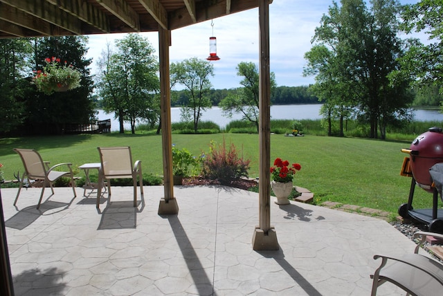 499 Tamarack Ct NE, Tenstrike, MN 56683 - view of patio featuring a water view