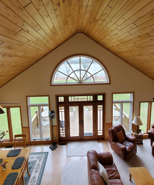 499 Tamarack Ct NE, Tenstrike, MN 56683 - foyer entrance featuring wooden ceiling, french doors, wainscoting, plenty of natural light, and wood finished floors