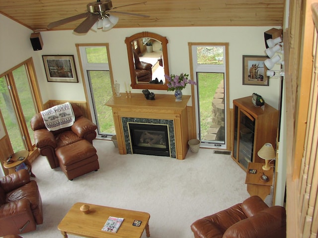 499 Tamarack Ct NE, Tenstrike, MN 56683 - carpeted living area with a premium fireplace, wood ceiling, plenty of natural light, and a ceiling fan