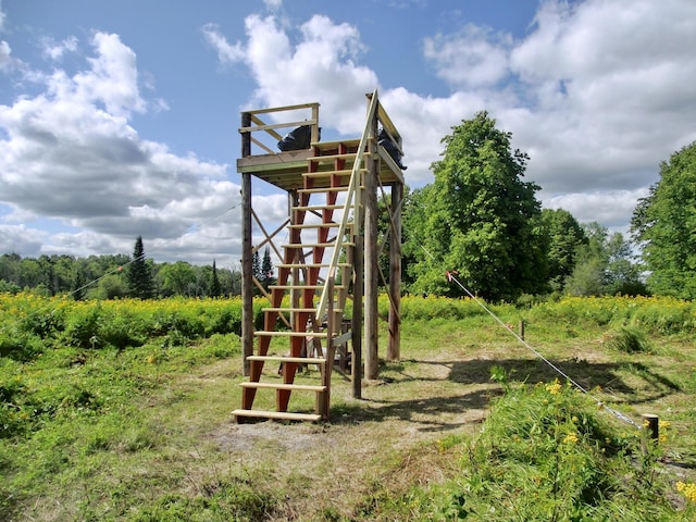499 Tamarack Ct NE, Tenstrike, MN 56683 - view of jungle gym featuring stairs