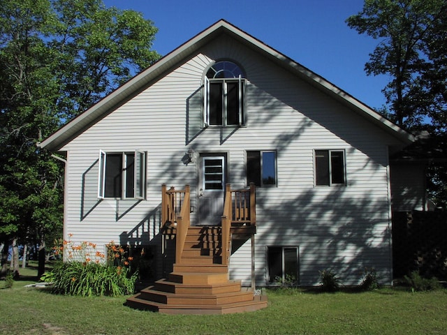 499 Tamarack Ct NE, Tenstrike, MN 56683 - back of house with a lawn
