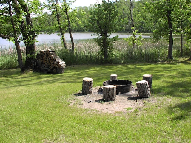 499 Tamarack Ct NE, Tenstrike, MN 56683 - view of green lawn with a water view