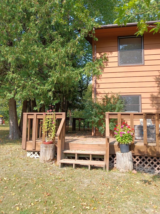 499 Tamarack Ct NE, Tenstrike, MN 56683 - view of green lawn with a deck