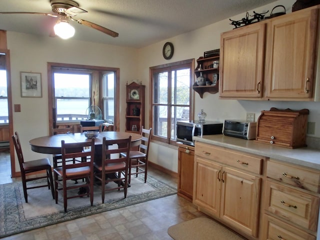 499 Tamarack Ct NE, Tenstrike, MN 56683 - kitchen with stainless steel microwave, light brown cabinets, a ceiling fan, light countertops, and open shelves