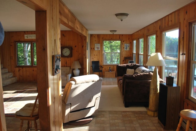 499 Tamarack Ct NE, Tenstrike, MN 56683 - living area with wooden walls and stairs
