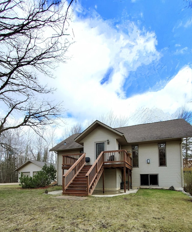 499 Tamarack Ct NE, Tenstrike, MN 56683 - back of house with a deck, stairway, a lawn, and a shingled roof