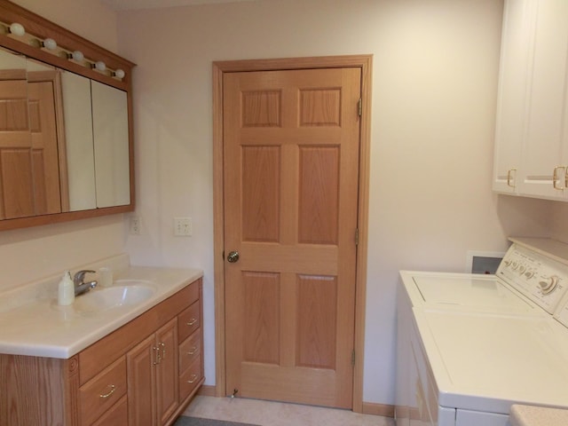 499 Tamarack Ct NE, Tenstrike, MN 56683 - clothes washing area with cabinet space and independent washer and dryer