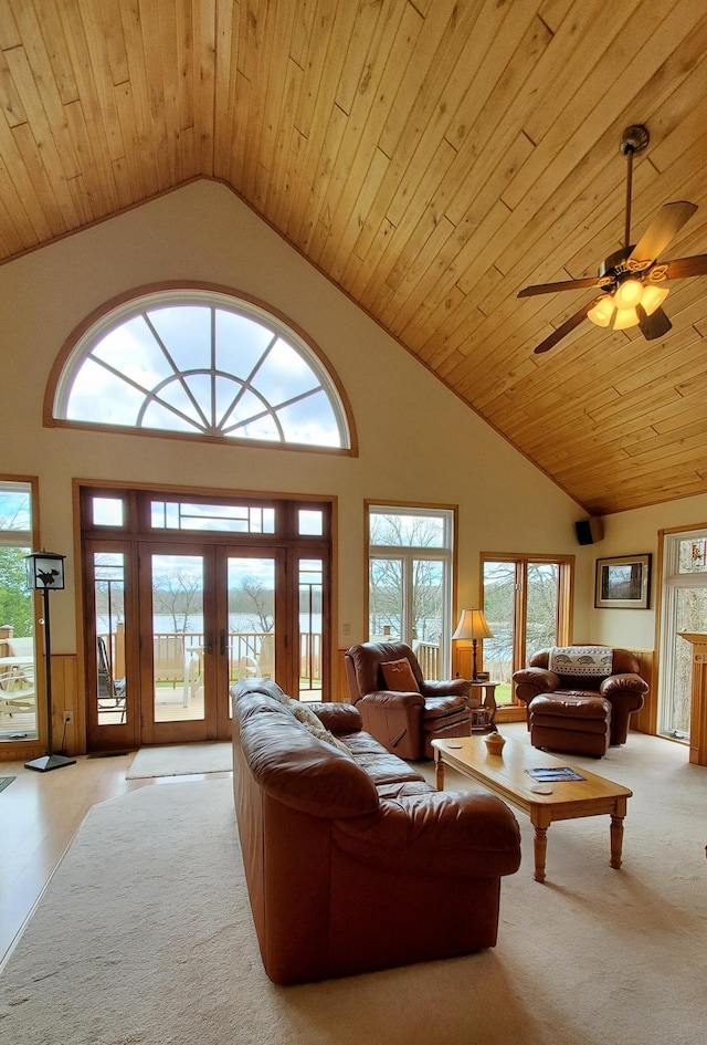 499 Tamarack Ct NE, Tenstrike, MN 56683 - living area with french doors, ceiling fan, carpet, wooden ceiling, and high vaulted ceiling