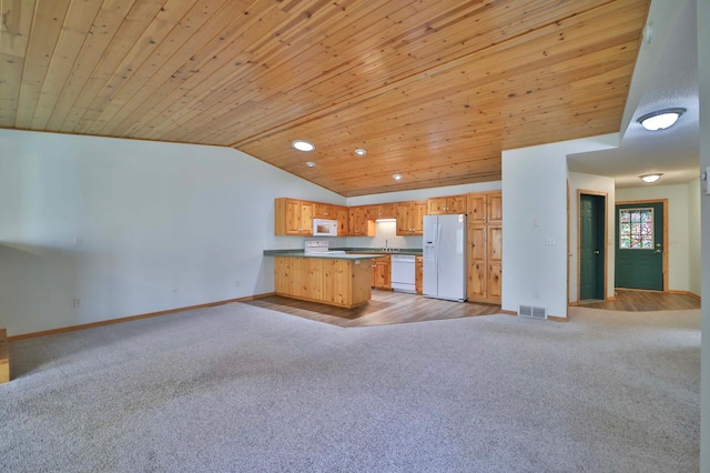 kitchen featuring white appliances, light colored carpet, open floor plan, lofted ceiling, and baseboards