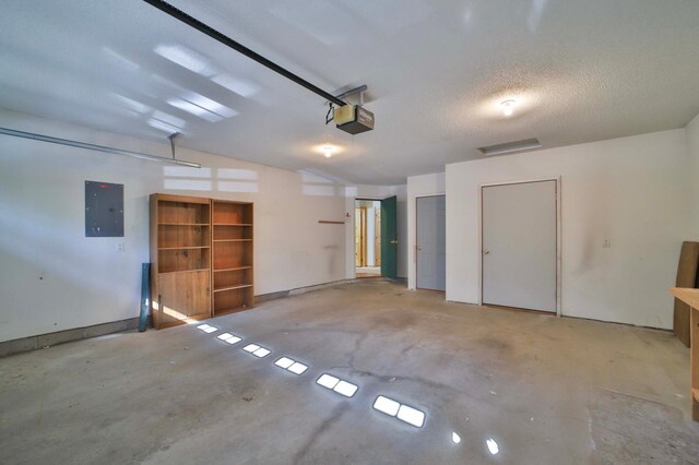 garage featuring a garage door opener and electric panel