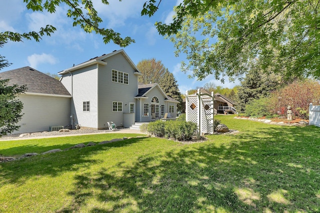1609 26th St SE, Saint Cloud, MN 56304 - back of house with a lawn