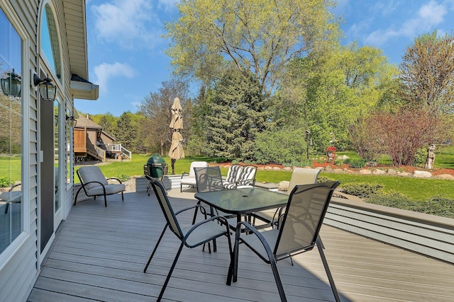 1609 26th St SE, Saint Cloud, MN 56304 - wooden deck featuring a lawn, an outdoor hangout area, and view of wooded area