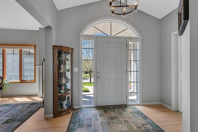 1609 26th St SE, Saint Cloud, MN 56304 - entrance foyer with wood finished floors, a chandelier, and baseboards