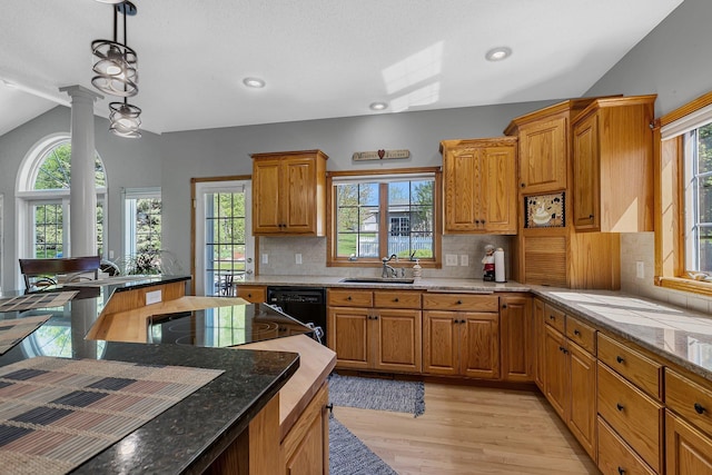 1609 26th St SE, Saint Cloud, MN 56304 - kitchen featuring a sink, healthy amount of natural light, dishwasher, lofted ceiling, and light wood-style flooring