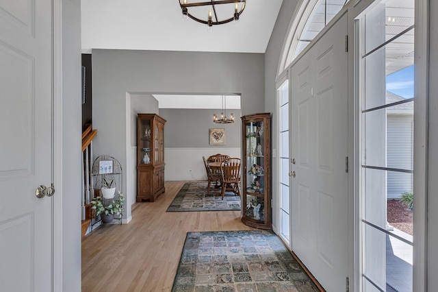 1609 26th St SE, Saint Cloud, MN 56304 - entrance foyer with a chandelier and light wood-type flooring