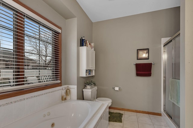 1609 26th St SE, Saint Cloud, MN 56304 - full bath with a tub with jets, a stall shower, toilet, and baseboards