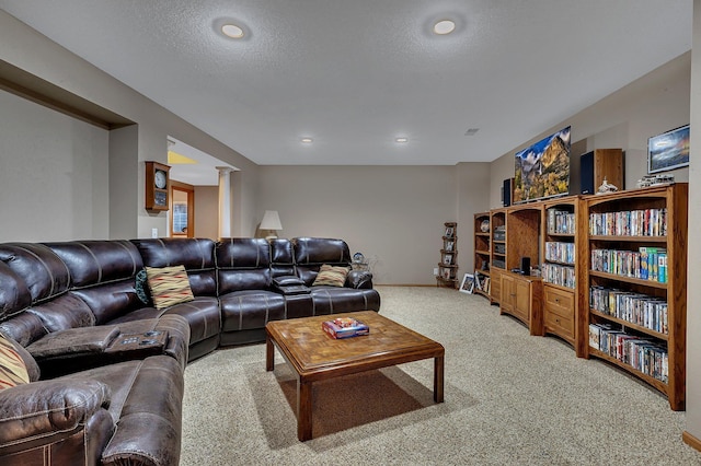 1609 26th St SE, Saint Cloud, MN 56304 - living area featuring light colored carpet, decorative columns, recessed lighting, baseboards, and a textured ceiling